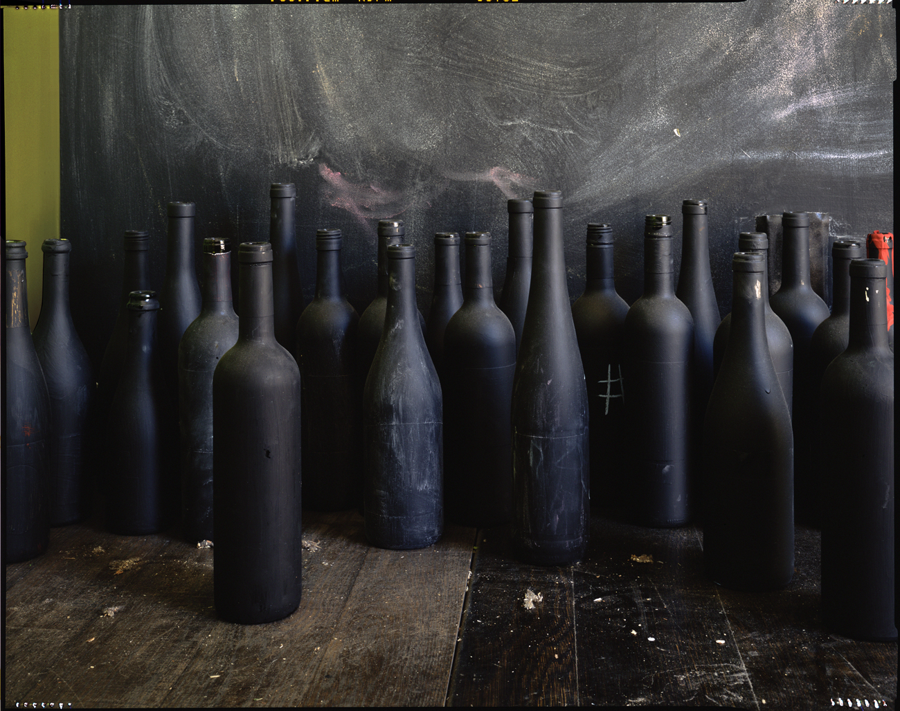 Wine bottles, liquor store window display, New York City, 2016