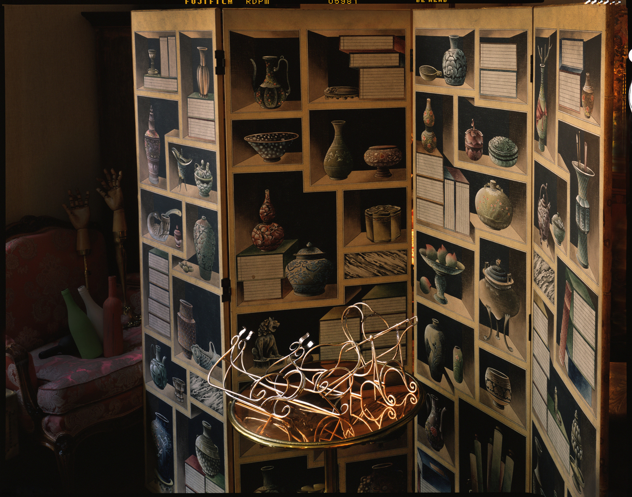Wine bottle holders and trompe l'oeil  screen, antique shop, New York City, 2015
